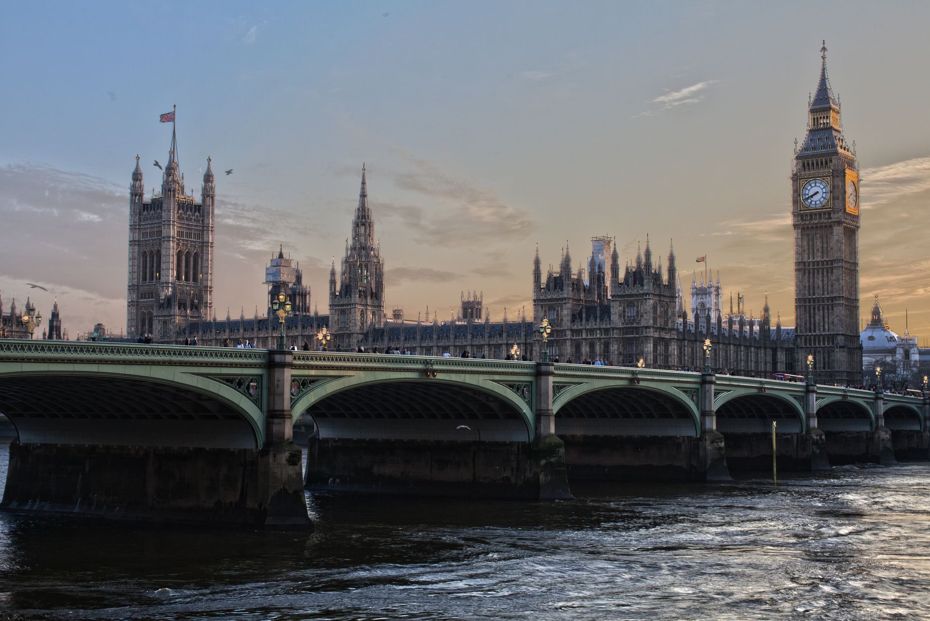 Stunning view of Big Ben and Westminster Bridge at sunset. Iconic London landmark.