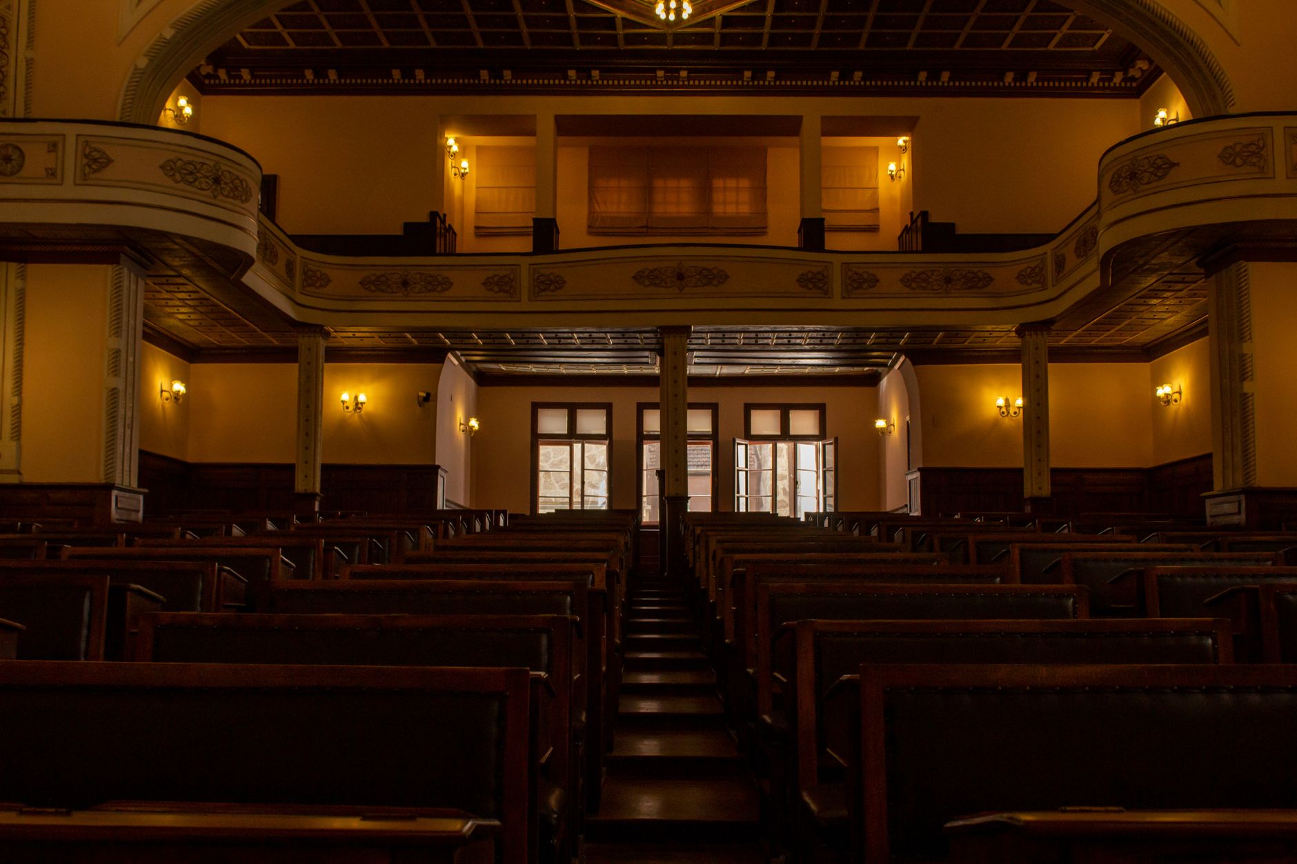 View of the historic Turkish parliament building interior in Ankara with classic wooden benches.