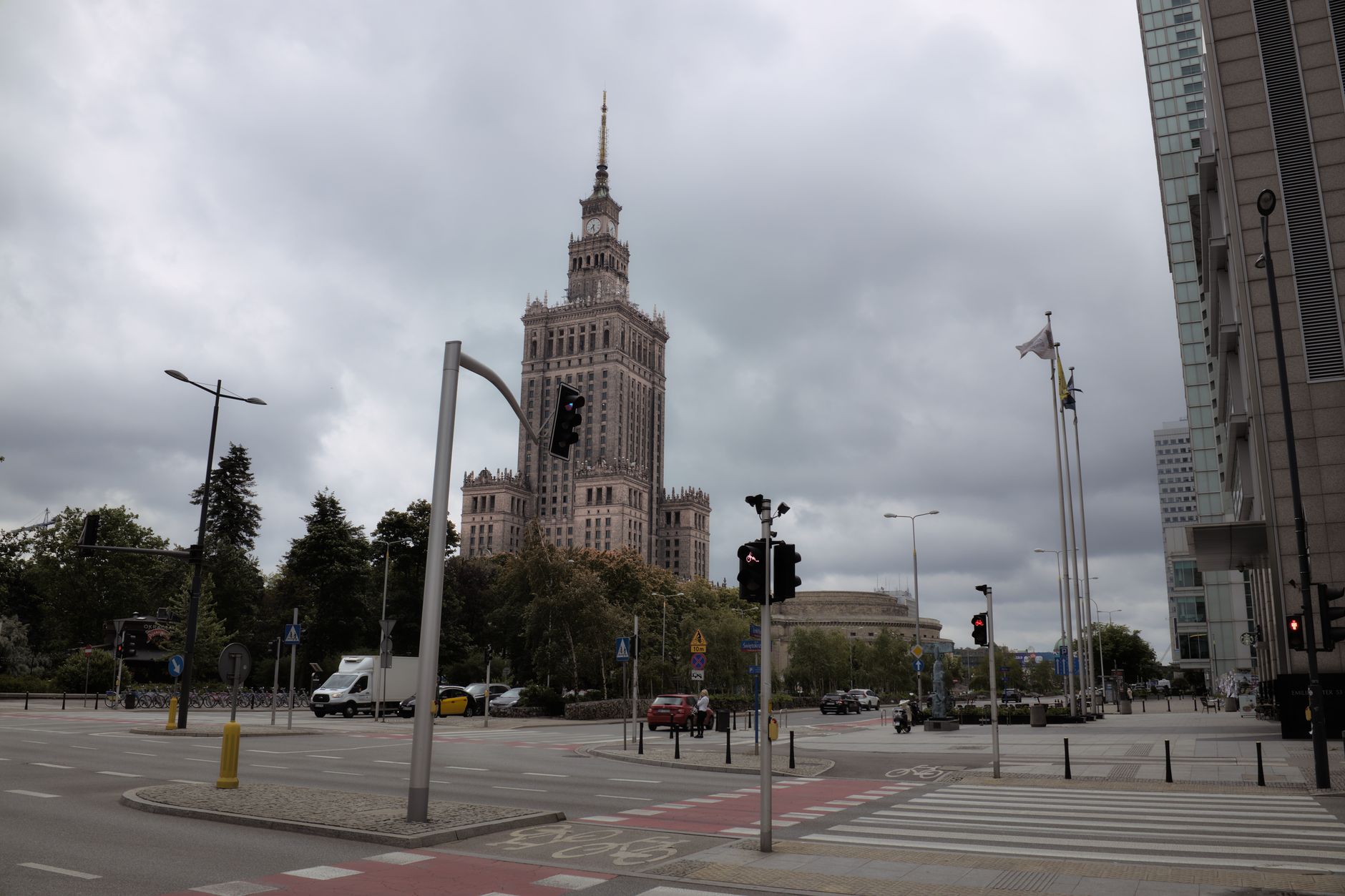 View of the Palace of Culture and Science in Warsaw under an overcast sky.
