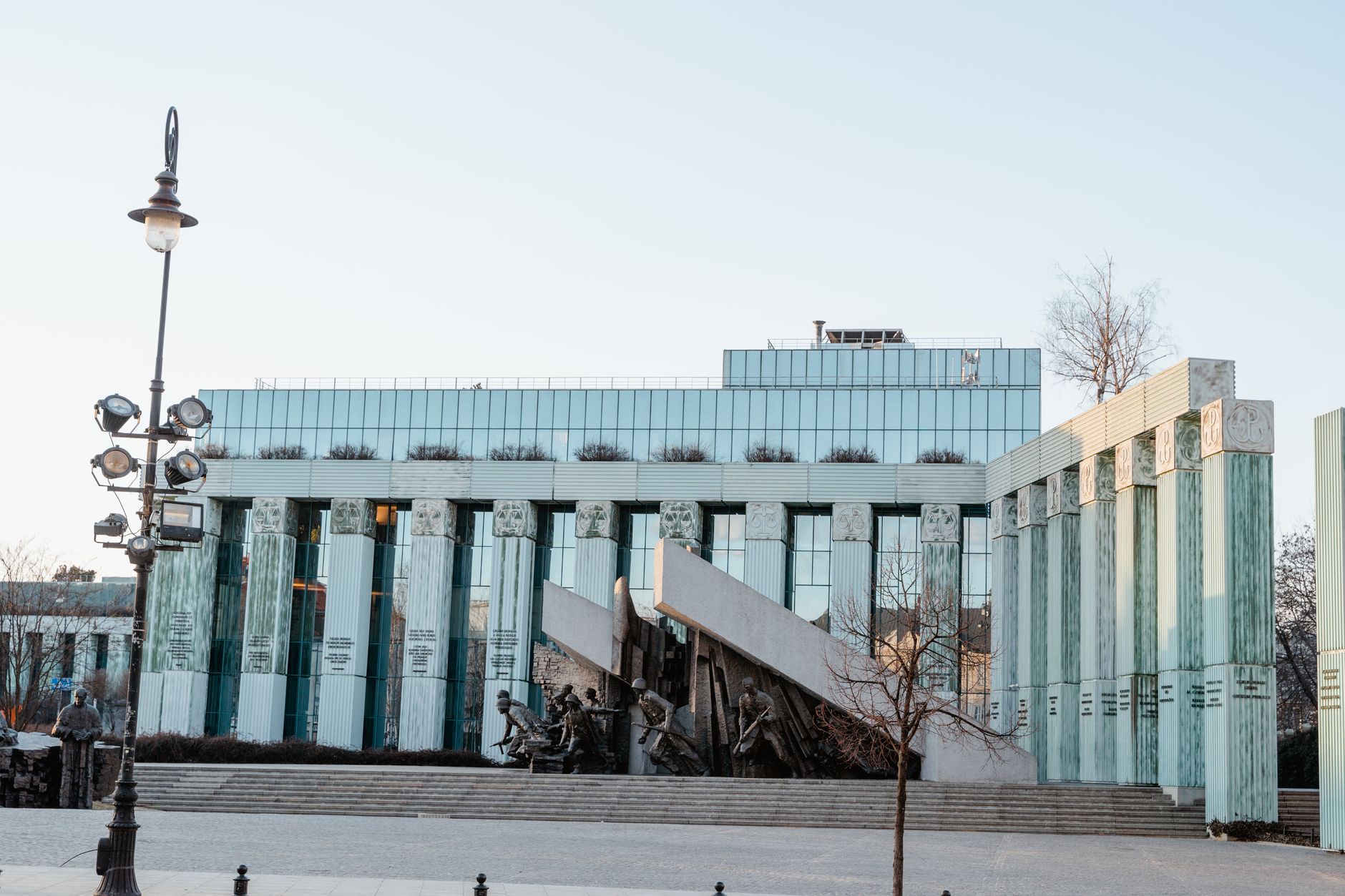 Daytime view of a modern building with classical elements in Warsaw.