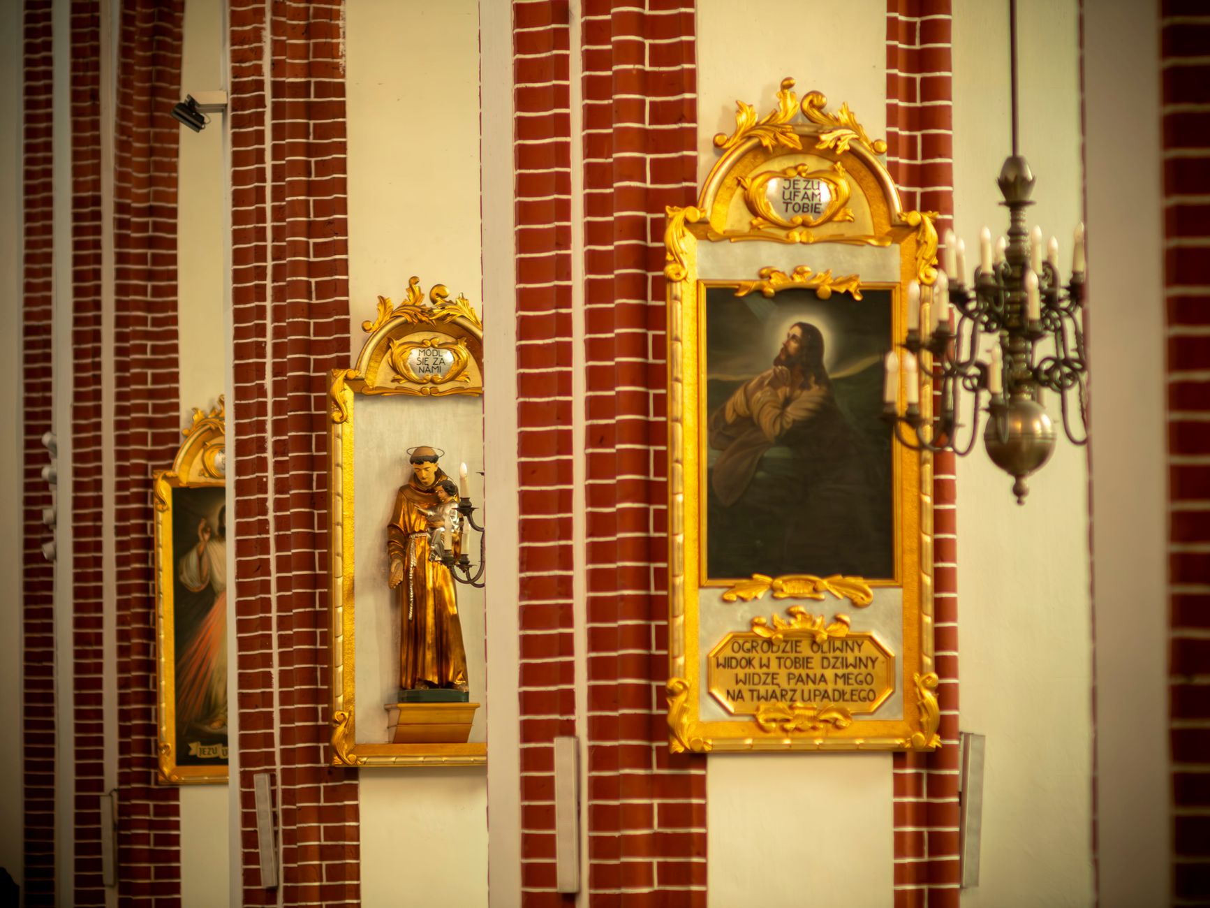 Intricate religious paintings and statues in Wrocław Cathedral, showcasing rich history and art.