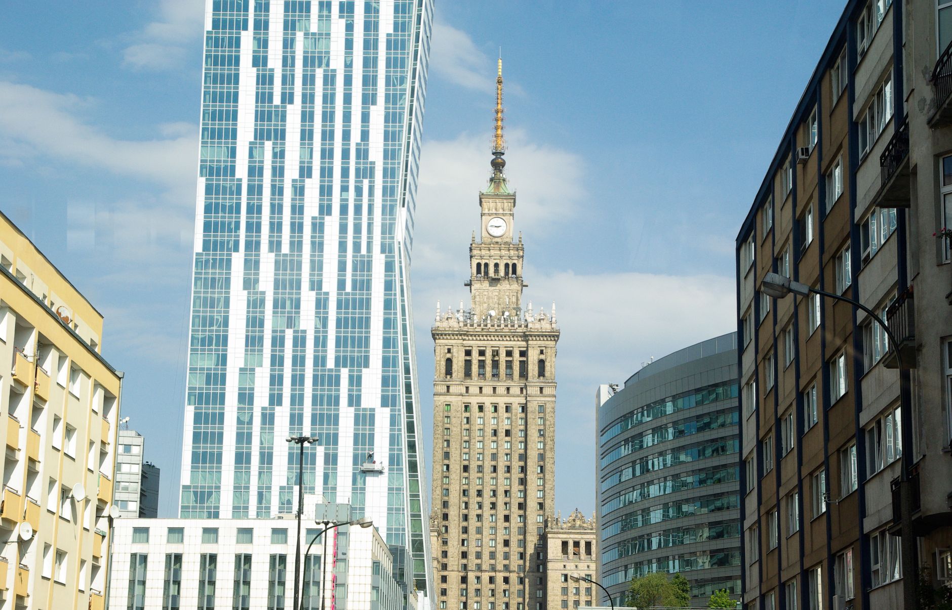 Dynamic view of Warsaw skyline showcasing modern and historical architecture in daylight.
